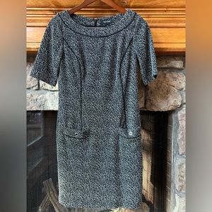 Black and white dress with black piping and black/silver buttons.